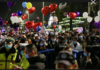 Crowds fill streets in China’s Covid-19 pandemic-hit Wuhan, celebrate New Year